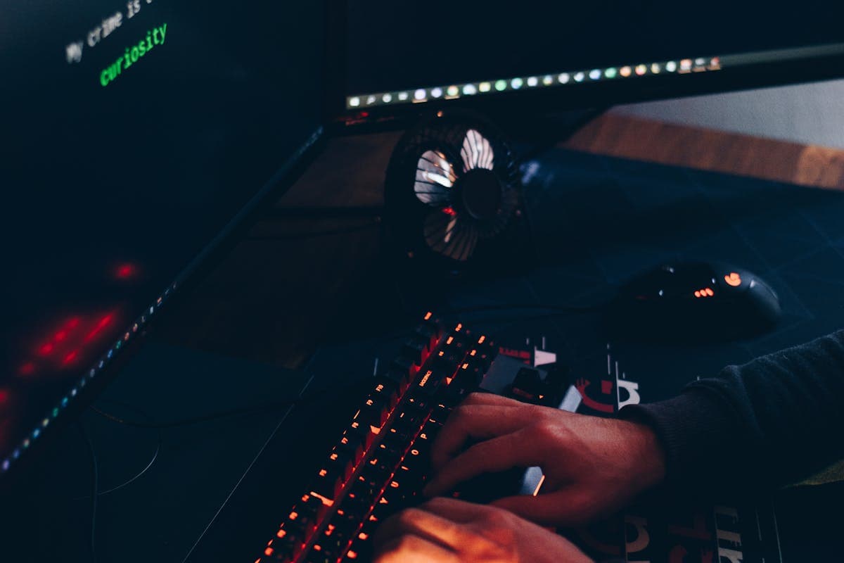 Hacker using laptop computer for email phishing attack